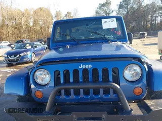 2009 Jeep Wrangler Sahara z VIN 1J4FA54199L722192, wystawiony jako IAAI lot #41619305 z przebiegiem 105 545 mil mil oraz . Historia ofert i sprzedaży dostępna na DreamBid. Obrazek 17.