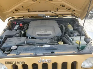 2013 Jeep Wrangler Unlimited Sport z VIN 1C4BJWDG7DL650142, wystawiony jako Copart lot #56846935 z przebiegiem 69 371 mil mil oraz Szkoda całkowita • Salvage title. Historia ofert i sprzedaży dostępna na DreamBid. Obrazek 12.