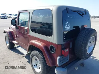 2004 Jeep Wrangler Sahara with VIN 1J4FA59S24P739581, listed as a IAAI auction lot 41696146 with 232,139 mi miles and . Bid and sale history available at DreamBid. Image 3.