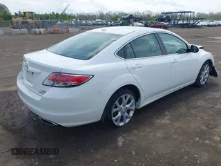 2009 Mazda 6 S Grand Touring with VIN 1YVHP82B995M09281, listed as a IAAI auction lot 42060946 with 102,423 mi miles and . Bid and sale history available at DreamBid. Image 4.