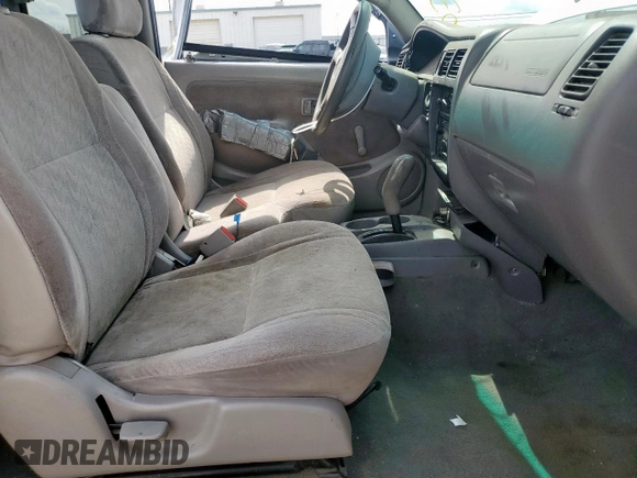 2003 Toyota Tacoma with VIN 5TEVL52N63Z207712, listed as a Copart auction lot 56349545 with 166,194 mi miles and Salvage title. Bid and sale history available at DreamBid. Image 7.