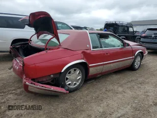 2002 Cadillac Eldorado z VIN 1G6EL12Y82B102243, wystawiony jako Copart lot #72717014 z przebiegiem 165 442 mil mil oraz Czysty tytuł • Clean title. Historia ofert i sprzedaży dostępna na DreamBid. Obrazek 3.
