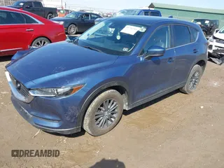 2021 Mazda CX-5 Touring with VIN JM3KFBCM4M0404093, listed as a IAAI auction lot 41751343 with 50,536 mi miles. Bid and sale history available at carsss.com. Image 2.