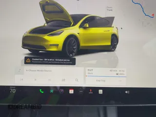 2022 Tesla Model Y Long Range with VIN 7SAYGDEE5NA016892, listed as a IAAI auction lot 41936735 with 69,136 mi miles and . Bid and sale history available at carsss.com. Image 17.