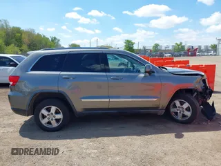 2011 Jeep Grand Cherokee Laredo with VIN 1J4RR4GGXBC587911, listed as a IAAI auction lot 42156885 with 178,999 mi miles and . Bid and sale history available at DreamBid. Image 13.