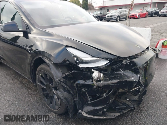 2023 Tesla Model Y Long Range with VIN 7SAYGDEE2PA024032, listed as a IAAI auction lot 41213403 with 23,418 mi miles and . Bid and sale history available at DreamBid. Image 6.