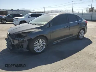 2017 Ford Focus Titanium z VIN 1FADP3J22HL279854, wystawiony jako Copart lot #61209135 z przebiegiem 106 323 mil mil oraz Szkoda całkowita • Salvage title. Historia ofert i sprzedaży dostępna na DreamBid. Obrazek 1.