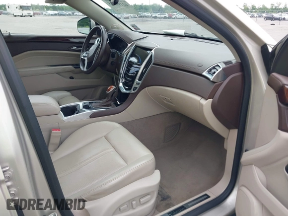 2015 Cadillac SRX Performance Collection with VIN 3GYFNCE34FS639168, listed as a IAAI auction lot 42191995 with 101,358 mi miles and . Bid and sale history available at DreamBid. Image 5.
