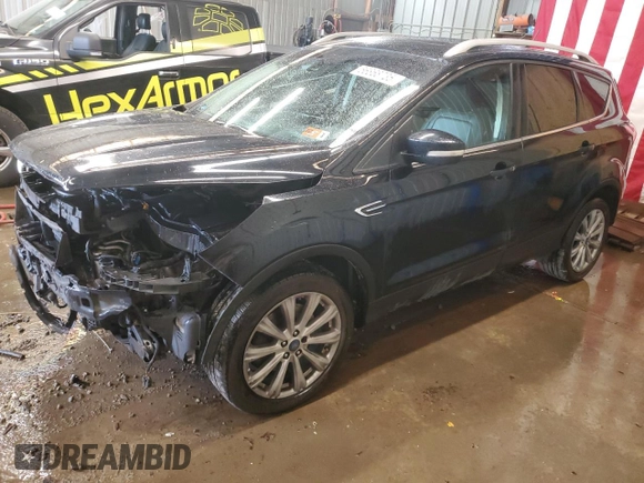 2018 Ford Escape Titanium with VIN 1FMCU9J9XJUA01357, listed as a Copart auction lot 56868735 with 67,315 mi miles and Salvage title. Bid and sale history available at DreamBid. Image 1.