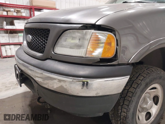 2002 Ford F-150 XL with VIN 1FTRX18W92KA81797, listed as a IAAI auction lot 42250147 with 162,918 mi miles and . Bid and sale history available at DreamBid. Image 6.