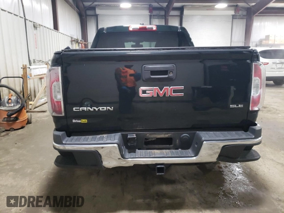 2015 GMC Canyon 4WD SLE with VIN 1GTG6BE38F1258880, listed as a Copart auction lot 57887664 with 142,346 mi miles and Salvage Title. Bid and sale history available at carsss.com. Image 6.