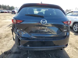 2019 Mazda CX-5 Grand Touring with VIN JM3KFBDM0K0571806, listed as a Copart auction lot 43395105 with 57,768 mi miles and Salvage Title. Bid and sale history available at carsss.com. Image 6.