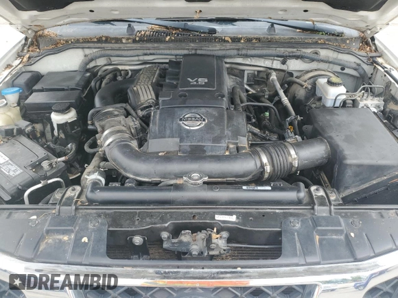 2012 Nissan Frontier Pro-4X с VIN 1N6AD0EV5CC409902, выставлен на аукционе Copart как лот 55239945 с пробегом 124 288 миль миль и Списание • Salvage title. История ставок и продаж доступна на DreamBid. Изображение 11.