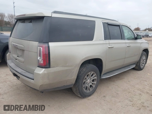 2015 GMC Yukon XL SLE z VIN 1GKS1GKC1FR155056, wystawiony jako IAAI lot #41517607 z przebiegiem 174 634 mil mil oraz . Historia ofert i sprzedaży dostępna na DreamBid. Obrazek 4.