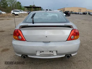 2003 Hyundai Tiburon GT z VIN KMHHN65F13U013420, wystawiony jako Copart lot #51234495 z przebiegiem 230 612 mil mil oraz Szkoda całkowita • Salvage title. Historia ofert i sprzedaży dostępna na DreamBid. Obrazek 6.