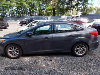 2018 Ford Focus SE z VIN 1FADP3FE0JL284107, wystawiony jako IAAI lot #42815845 z przebiegiem 110 155 mil mil oraz . Historia ofert i sprzedaży dostępna na DreamBid. Obrazek 14.