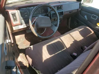 1991 Nissan Frontier XE with VIN 1N6SD11S2MC412375, listed as a Copart auction lot 61015515 with 201,629 mi miles and Salvage title. Bid and sale history available at DreamBid. Image 8.