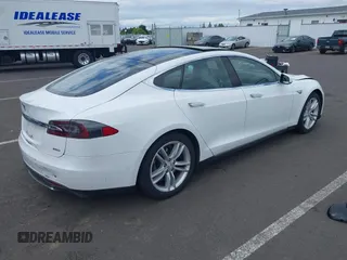 2016 Tesla Model S 90D with VIN 5YJSA1E21GF121962, listed as a IAAI auction lot 42130291 with 114,670 mi miles and . Bid and sale history available at DreamBid. Image 4.