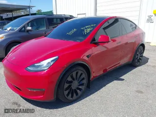 2023 Tesla Model Y Long Range with VIN 7SAYGDEE0PA094810, listed as a IAAI auction lot 41998312 with 10,376 mi miles. Bid and sale history available at carsss.com. Image 2.