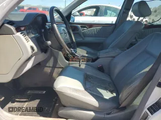 1999 Mercedes-Benz E-Class with VIN WDBJF65H0XA877630, listed as a Copart auction lot 69697454 with 0 mi miles and Salvage Title. Bid and sale history available at carsss.com. Image 7.