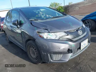 2015 Honda Fit LX z VIN 3HGGK5H51FM774707, wystawiony jako IAAI lot #42228746 z przebiegiem 238 489 mil mil oraz . Historia ofert i sprzedaży dostępna na DreamBid. Obrazek 1.