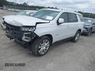 2023 Chevrolet Tahoe High Country z VIN 1GNSCTKL1PR544951, wystawiony jako IAAI lot #42113529 z przebiegiem 33 106 mil mil oraz . Historia ofert i sprzedaży dostępna na DreamBid. Obrazek 2.