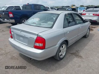 2002 Mazda Protege DX z VIN JM1BJ225921576001, wystawiony jako IAAI lot #40165055 z przebiegiem Nie podano mil oraz . Historia ofert i sprzedaży dostępna na DreamBid. Obrazek 4.