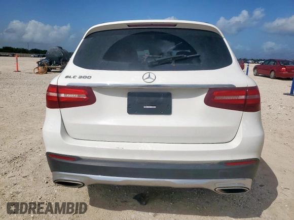 2018 Mercedes-Benz GLC 300 with VIN WDC0G4JB3JV025492, listed as a Copart auction lot 61674235 with 99,671 mi miles and Salvage title. Bid and sale history available at DreamBid. Image 6.