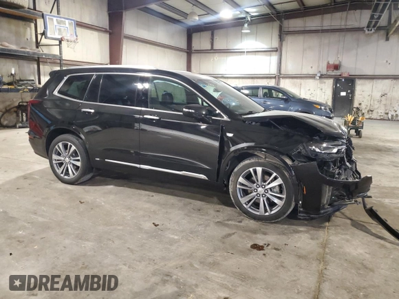 2020 Cadillac XT6 FWD Premium Luxury with VIN 1GYKPCRSXLZ154638, listed as a Copart auction lot 57439835 with 142,435 mi miles and Salvage title. Bid and sale history available at DreamBid. Image 4.