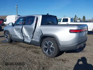 2023 Rivian R1T Adventure with VIN 7FCTGAAA0PN021864, listed as a IAAI auction lot 41620630 with 1 mi miles. Bid and sale history available at carsss.com. Image 3.