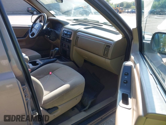 2001 Jeep Grand Cherokee Laredo with VIN 1J4GW48S31C626727, listed as a IAAI auction lot 42796974 with 132,988 mi miles and . Bid and sale history available at DreamBid. Image 5.