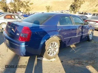 2009 Chrysler 300 Touring with VIN 2C3LA53V89H565270, listed as a IAAI auction lot 41069505 with 112,830 mi miles. Bid and sale history available at carsss.com. Image 4.