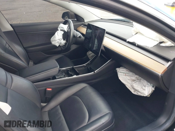 2018 Tesla Model 3 Long Range Battery with VIN 5YJ3E1EA9JF009384, listed as a IAAI auction lot 41544624 with 66,896 mi miles and . Bid and sale history available at DreamBid. Image 5.