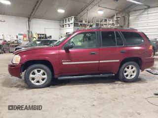2006 GMC Envoy SLT with VIN 1GKDS13S362135683, listed as a IAAI auction lot 41477501 with 214,760 mi miles. Bid and sale history available at carsss.com. Image 14.