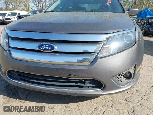 2012 Ford Fusion SE z VIN 3FAHP0HA4CR306608, wystawiony jako IAAI lot #41939924 z przebiegiem 176 689 mil mil oraz . Historia ofert i sprzedaży dostępna na DreamBid. Obrazek 6.
