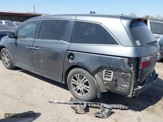 2012 Honda Odyssey EX-L with VIN 5FNRL5H64CB131197, listed as a IAAI auction lot 41829107 with 215,115 mi miles. Bid and sale history available at carsss.com. Image 3.