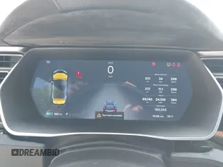 2014 Tesla Model S 60 with VIN 5YJSA1H17EFP65983, listed as a IAAI auction lot 42399288 with 166,365 mi miles and . Bid and sale history available at DreamBid. Image 7.