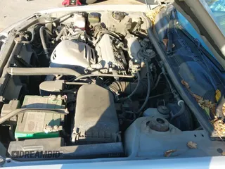 2000 Toyota Camry LE z VIN JT2BG22K5Y0456904, wystawiony jako IAAI lot #43519495 z przebiegiem 113 828 mil mil oraz . Historia ofert i sprzedaży dostępna na DreamBid. Obrazek 13.