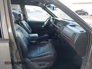 1998 Jeep Grand Cherokee Laredo with VIN 1J4GZ58S9WC136684, listed as a IAAI auction lot 41444103 with 1 mi miles. Bid and sale history available at carsss.com. Image 5.