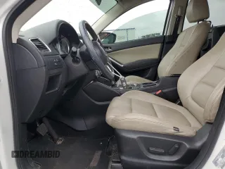 2016 Mazda CX-5 Touring z VIN JM3KE2CY5G0849288, wystawiony jako Copart lot #54594545 z przebiegiem 90 882 mil mil oraz Szkoda całkowita • Salvage title. Historia ofert i sprzedaży dostępna na DreamBid. Obrazek 7.