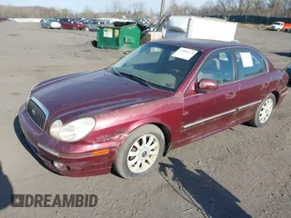 2002 Hyundai Sonata GLS with VIN KMHWF35H42A512538, listed as a IAAI auction lot 42000170 with 157,172 mi miles. Bid and sale history available at carsss.com. Image 2.