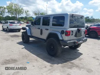 2021 Jeep Wrangler Unlimited Sahara with VIN 1C4HJXEN9MW637288, listed as a IAAI auction lot 42553459 with 39,362 mi miles and . Bid and sale history available at DreamBid. Image 3.