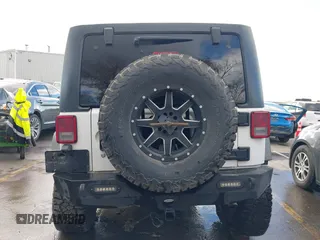 2014 Jeep Wrangler Unlimited Rubicon with VIN 1C4BJWFG2EL264792, listed as a IAAI auction lot 40938380 with 145,886 mi miles. Bid and sale history available at carsss.com. Image 17.