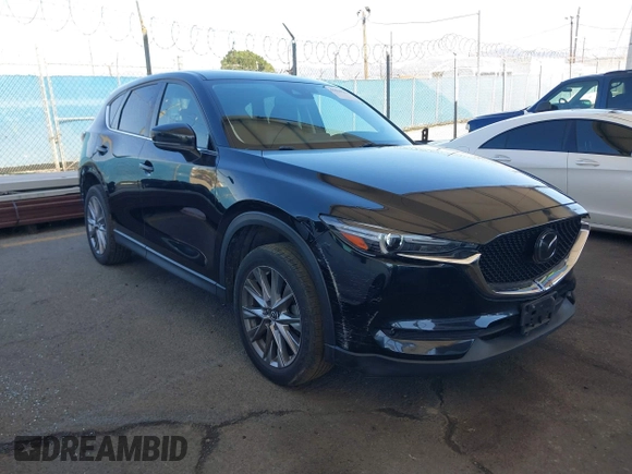 2020 Mazda CX-5 Grand Touring z VIN JM3KFADMXL0740144, wystawiony jako IAAI lot #41830203 z przebiegiem 70 535 mil mil oraz . Historia ofert i sprzedaży dostępna na DreamBid. Obrazek 1.