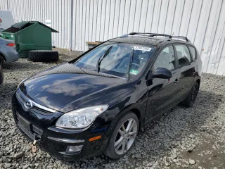 2012 Hyundai Elantra Touring SE with VIN KMHDC8AE0CU137417, listed as a Copart auction lot 47947295 with 141,259 mi miles and Salvage Title. Bid and sale history available at carsss.com. Image 1.
