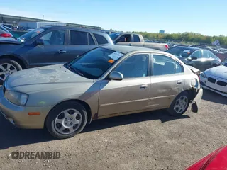 2003 Hyundai Elantra GLS z VIN KMHDN45D93U495703, wystawiony jako IAAI lot #42137927 z przebiegiem 93 287 mil mil oraz . Historia ofert i sprzedaży dostępna na DreamBid. Obrazek 14.