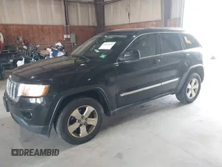 2012 Jeep Grand Cherokee Laredo with VIN 1C4RJFAT8CC182128, listed as a IAAI auction lot 40154044 with 239,601 mi miles. Bid and sale history available at carsss.com. Image 2.