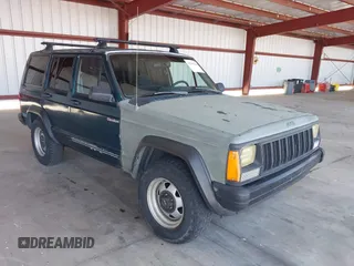 1996 Jeep Cherokee SE z VIN 1J4FJ28S2TL213621, wystawiony jako IAAI lot #42245620 z przebiegiem 184 862 mil mil oraz . Historia ofert i sprzedaży dostępna na DreamBid. Obrazek 1.