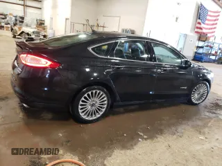 2014 Ford Fusion Titanium Hybrid z VIN 3FA6P0RUXER168706, wystawiony jako Copart lot #55362295 z przebiegiem 136 382 mil mil oraz Czysty tytuł • Clean title. Historia ofert i sprzedaży dostępna na DreamBid. Obrazek 3.
