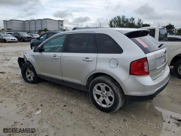 2013 Ford Edge SEL with VIN 2FMDK3JC1DBE31078, listed as a Copart auction lot 74811844 with 184,840 mi miles and Salvage Title. Bid and sale history available at carsss.com. Image 2.